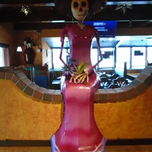 Another life sized skeleton watching over patrons.