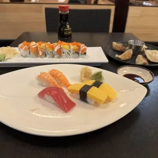 Alaskan mango roll, pork gyoza (), ebi, maguro, and tamago nigiris.