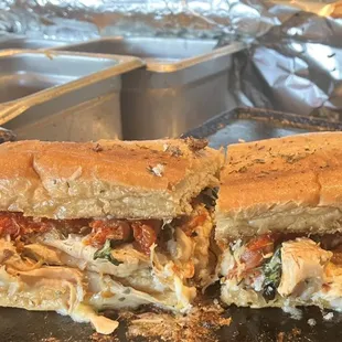 The Salvatore  Grilled chicken, fresh, basil, sun-dried, tomato, EVOO, Italian seasoning and provolone.