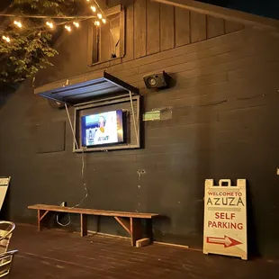 a television in the window of a restaurant