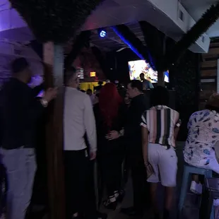 a group of people at a bar