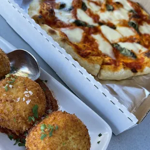 Arancini: 3 for $15; crispy crust and creamy rice, but lacking flavor. And a Margherita Pizza: good crust.
