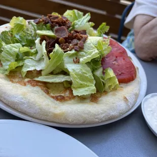 B.B.L.T. Manciata, Heirloom Tomatoes, Hobb&apos;s Bacon, Romaine, Blue Cheese Dressing.