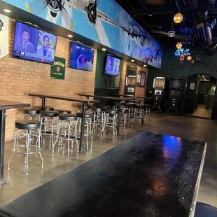 bar seating and televisions