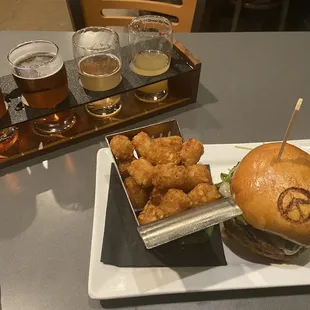 The Carlton Burger with Tater Tots and a  beer flight