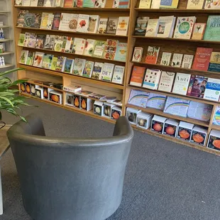 a chair in front of a bookshelf
