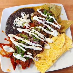 Chilaquiles with birria on top and both red and green sauce mix