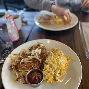 Chorizo omelette with hash browns on the side.