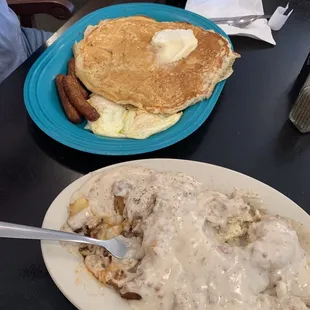 Massive pancakes with fried eggs and sausage. One biscuit with sausage gravy and home fried potatoes. Just delicious