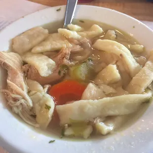 Homemade noodles in tasty chicken noodle soup.