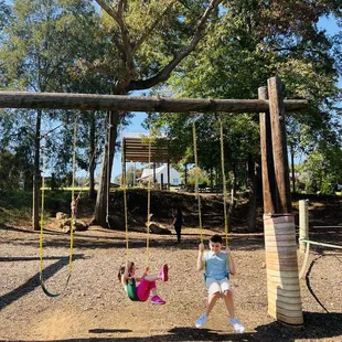two children on swings