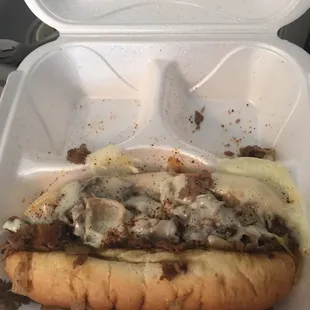 a sandwich in a styrofoam container