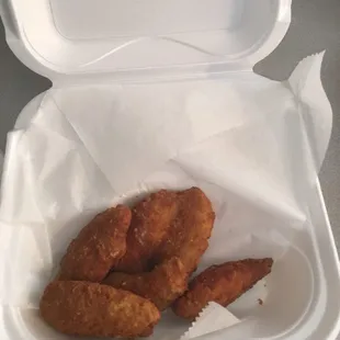 chicken nuggies in a styrofoam container