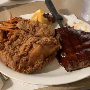 1/3 rack of ribs &amp; broasted chicken with sweet potato fries. ($15.99 Dinner Special) with salad bar.