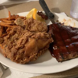 1/3 rack of ribs &amp; broasted chicken with sweet potato fries. ($15.99 Dinner Special) with salad bar.