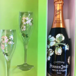 a bottle and two glasses