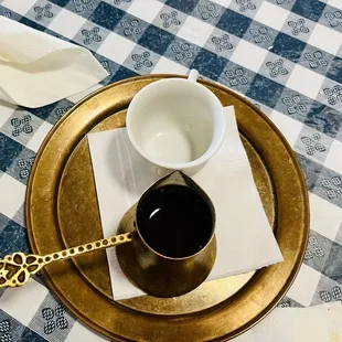  a cup of coffee on a plate