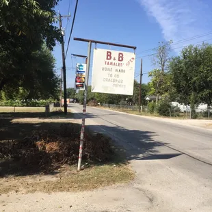 The other side of the sign reads " fuck you Rick Bayless " jk but it should