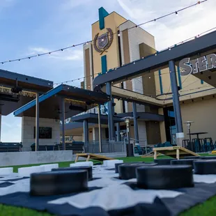 View of giant checkers lawn game and cabanas in the background