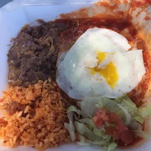 red chile chicken enchilada with egg.