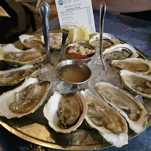 Oysters 11/30.$4 each. Funky and not shucked well  (oysters were still stuck to the adductor muscle).