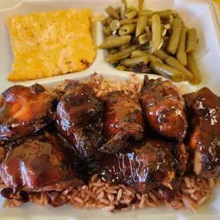 Jerk Chicken on rice with green beans and mac and cheese