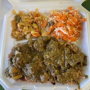 Curry goat with cabbage and Jamaican slaw