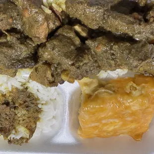 Curry goat with Mac n cheese
