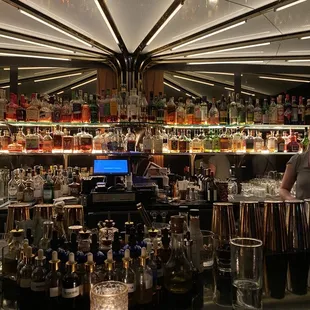 a bar with a lot of bottles of alcohol