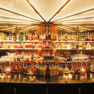 a bar with many bottles of alcohol