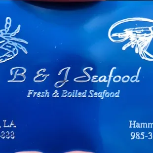 a hand holding a business card