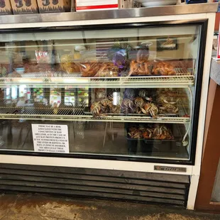 a display case filled with donuts