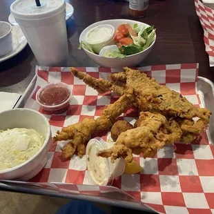 One soft shell crab platter with side of potato salad and green salad. You can also order a 2 crab platter