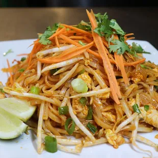 Pad Thai (Red Sauce)- rice noodles, eggs, bean sprouts, green onions, hint of tamarind cooked in a smokey paprika sauce.