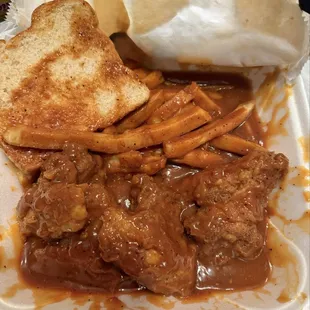 Wings n fries smothered in sauce!