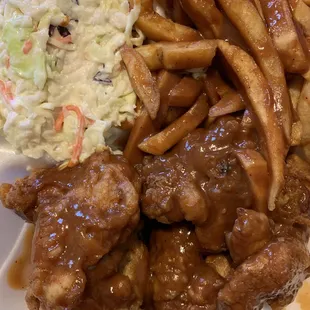 Wings with sauce, fries with sauce and cole slaw