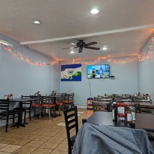 a restaurant with tables and chairs