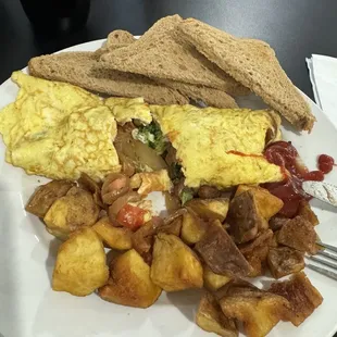 Veggie omelet with wheat toast and home fries