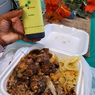 Oxtail w/ rice and peas  cabbage Sorrel Drink
