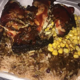 Jerk chicken with rice and peas, and a side of corn. Everything was good!