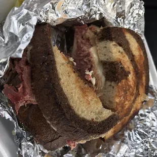a sandwich wrapped in tin foil