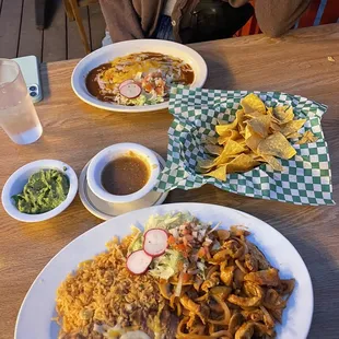 Pollo Chipotle dish with corn tortilla on the side &amp; a classic cheese enchilada