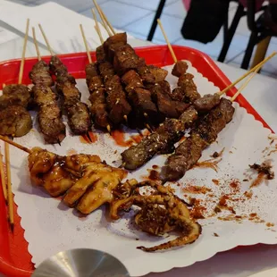 Liver, pork belly, beef, squid skewers