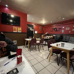 a man sitting at a table in a restaurant