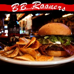 a burger and chips on a plate