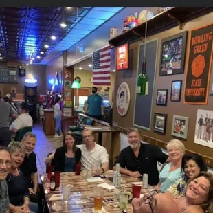 a group of people sitting at a table