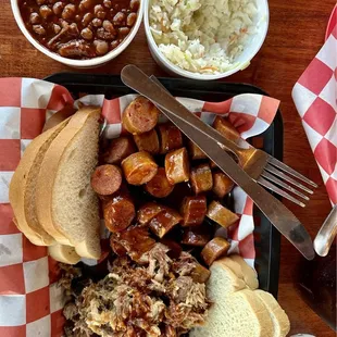 Pulled pork, sausage, baked beans, and cole slaw