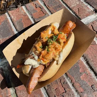  a hot dog with cheese and onions