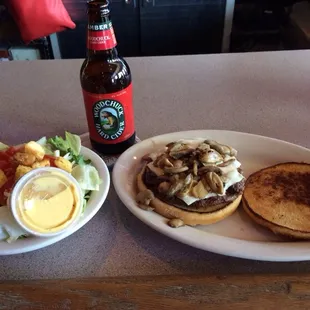 Lunch of champions... Mushroom &amp; Swiss Burger with side salad and Woodchuck. The food was on special- 5 bucks!