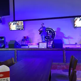  a bar with purple lighting